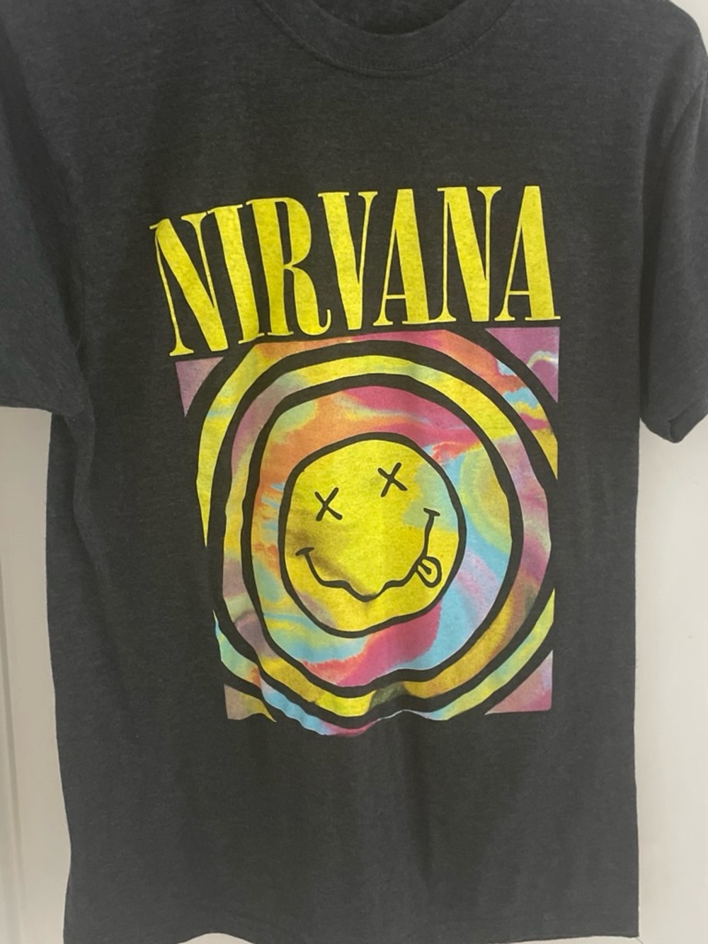 NIRVANA Black Tee with Yellow Logo and Rainbow Tie-Dye Smiley